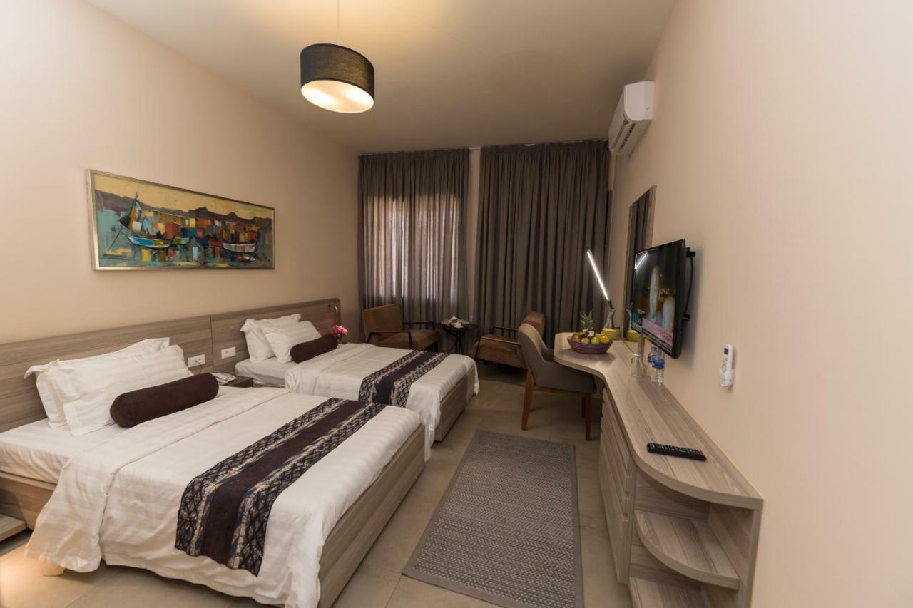 Roots Hotel Apartments Абиджан Экстерьер фото